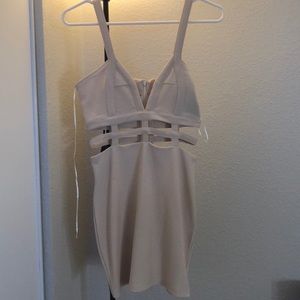 Never Worn cream dress with cut outs!